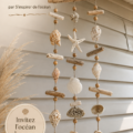 Suspension en coquillage décorative ajoutant une ambiance marine à la pièce
