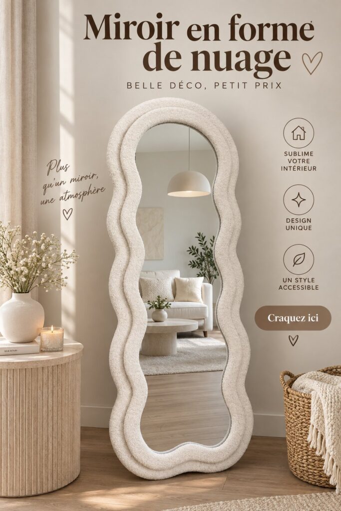 Miroir en forme de nuage accroché au mur dans une chambre au style cocooning.